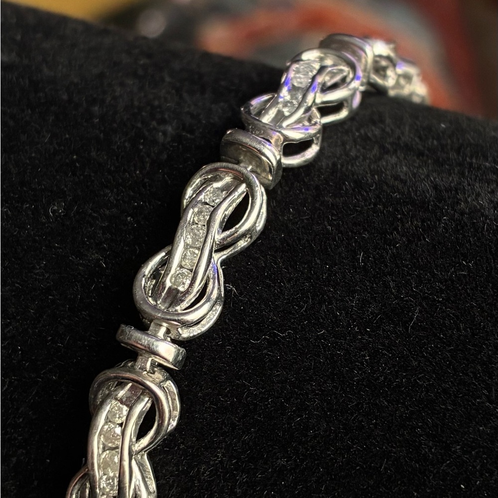 Sterling Silver White Crystal Infinity Knot Tennis Bracelet. Exquisite